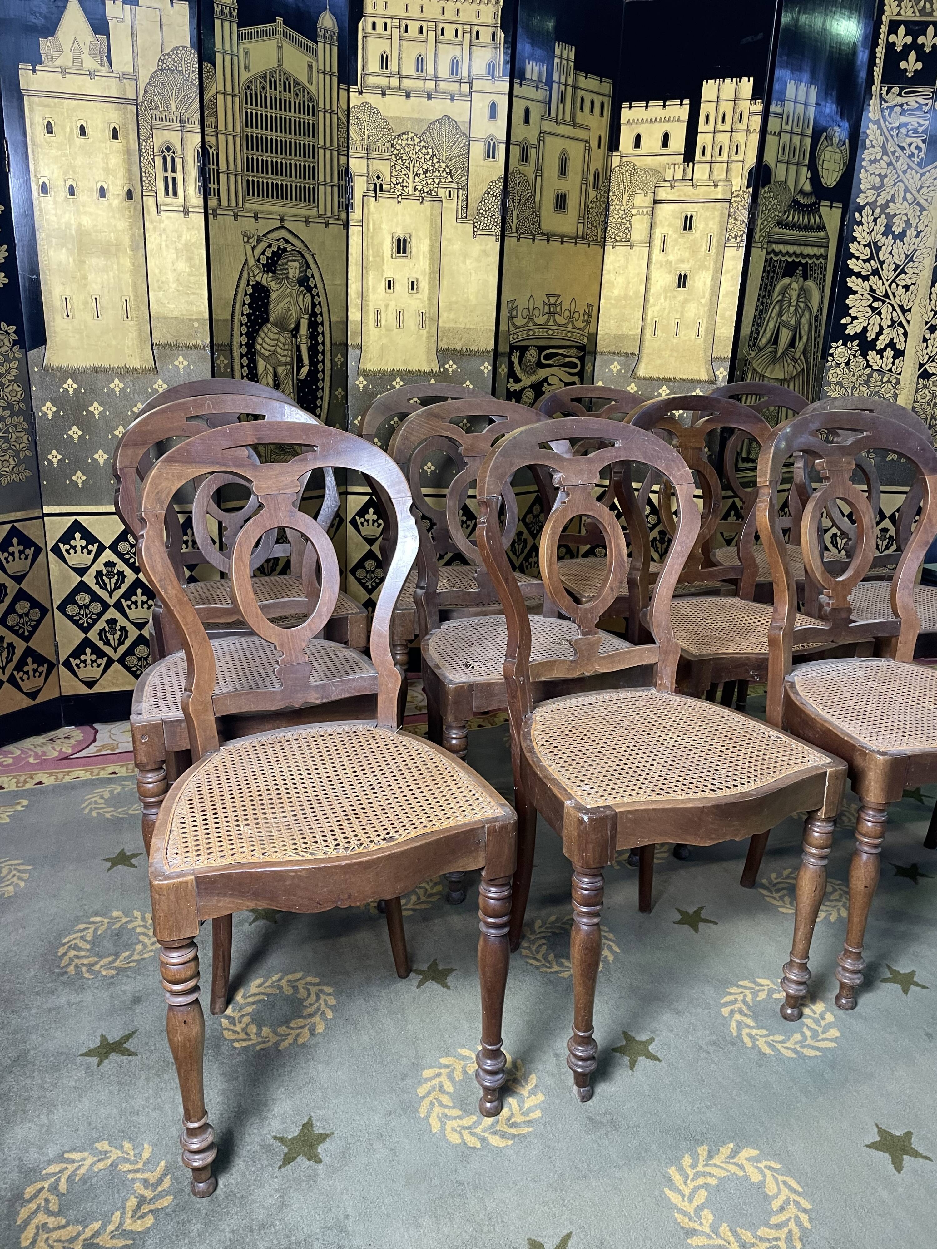Suite of 12 Louis Philippe period chairs in walnut and canning
