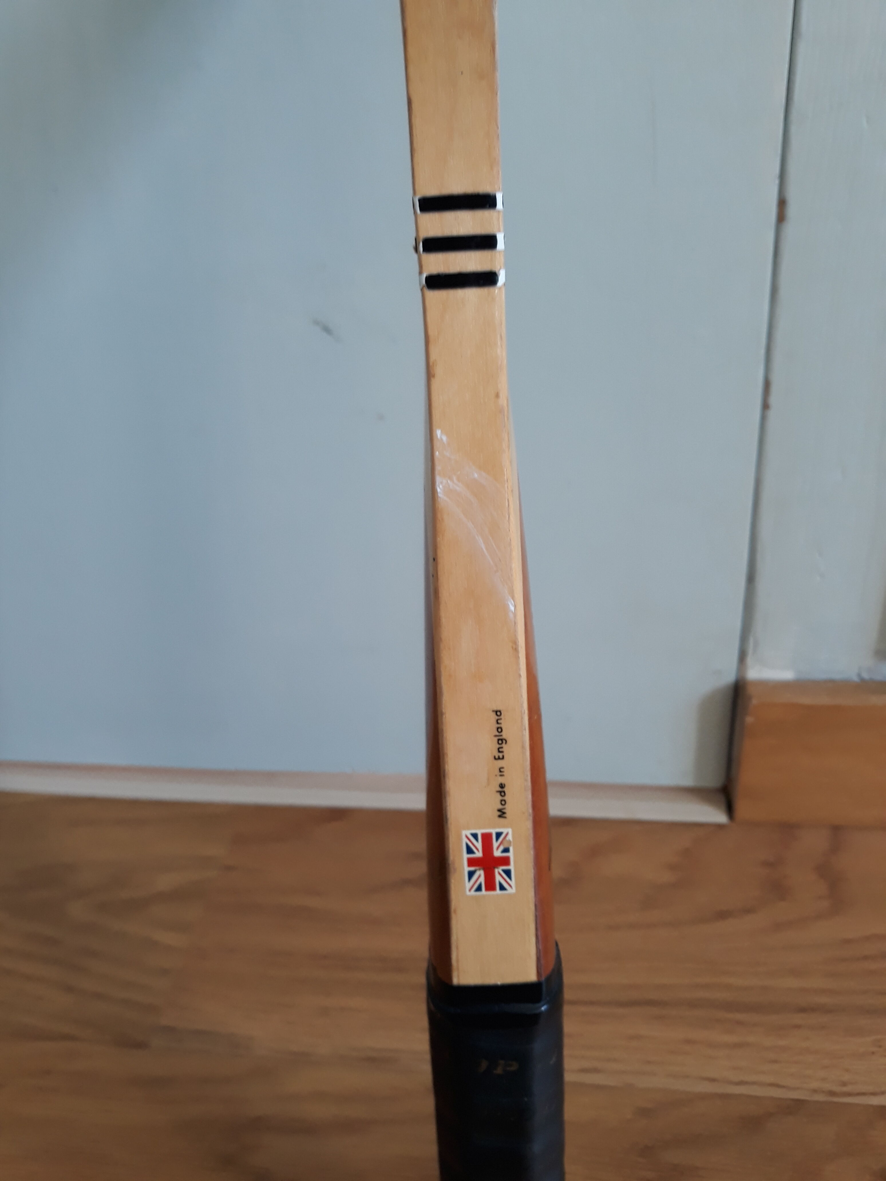 Wooden Dunlop tennis racket with its cover