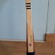 Wooden Dunlop tennis racket with its cover