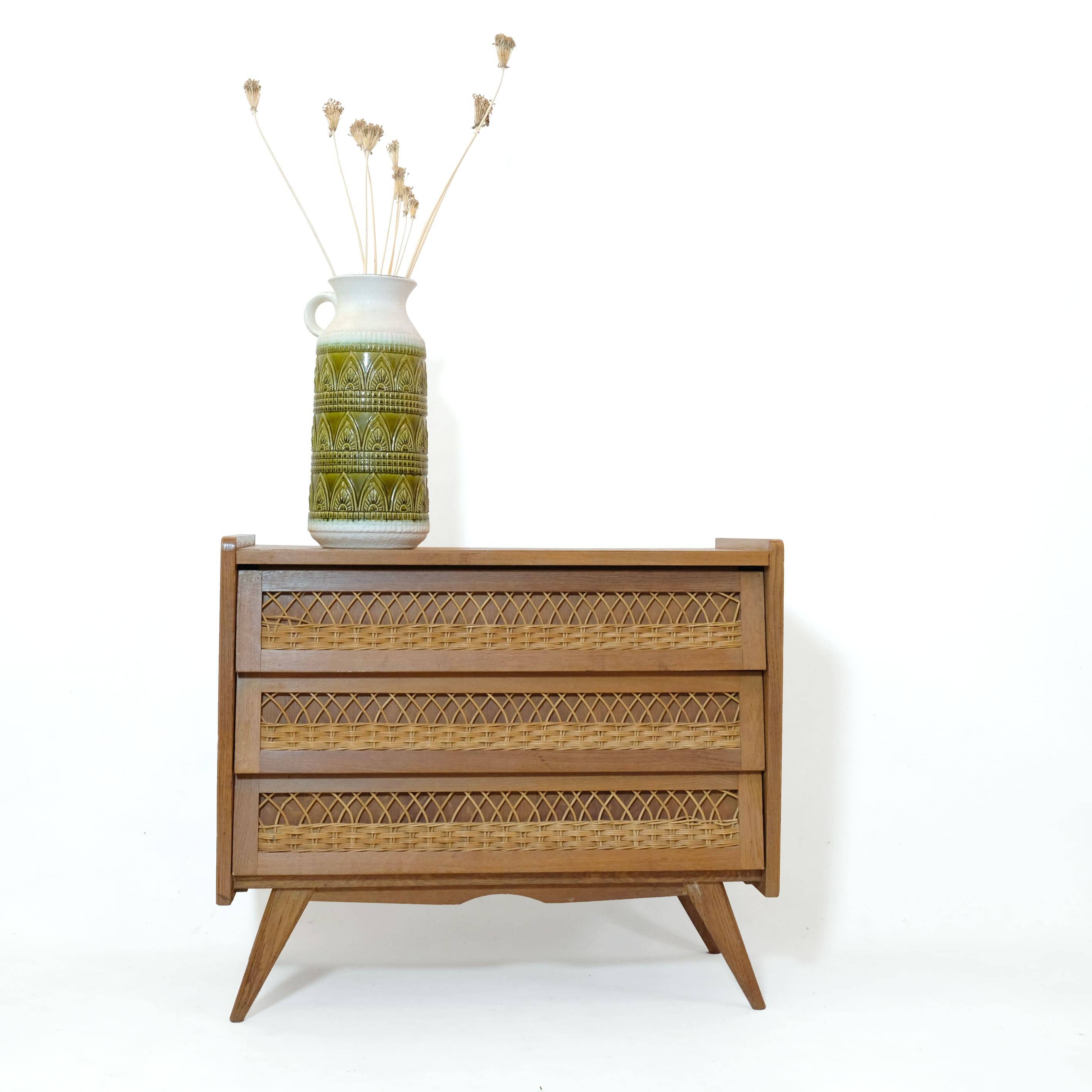 Wooden and rattan chest of drawers from the 60s.