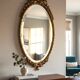 Bronze mirror in Hollywood Regency style from the 1940s/50s.