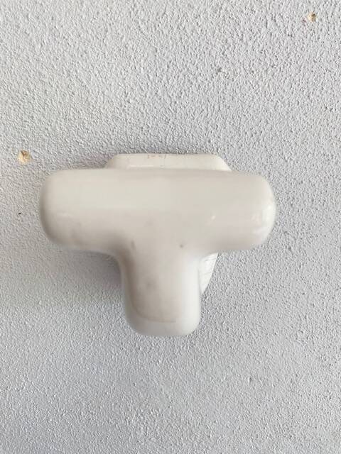 Enamelled earthen coat hook, 1900