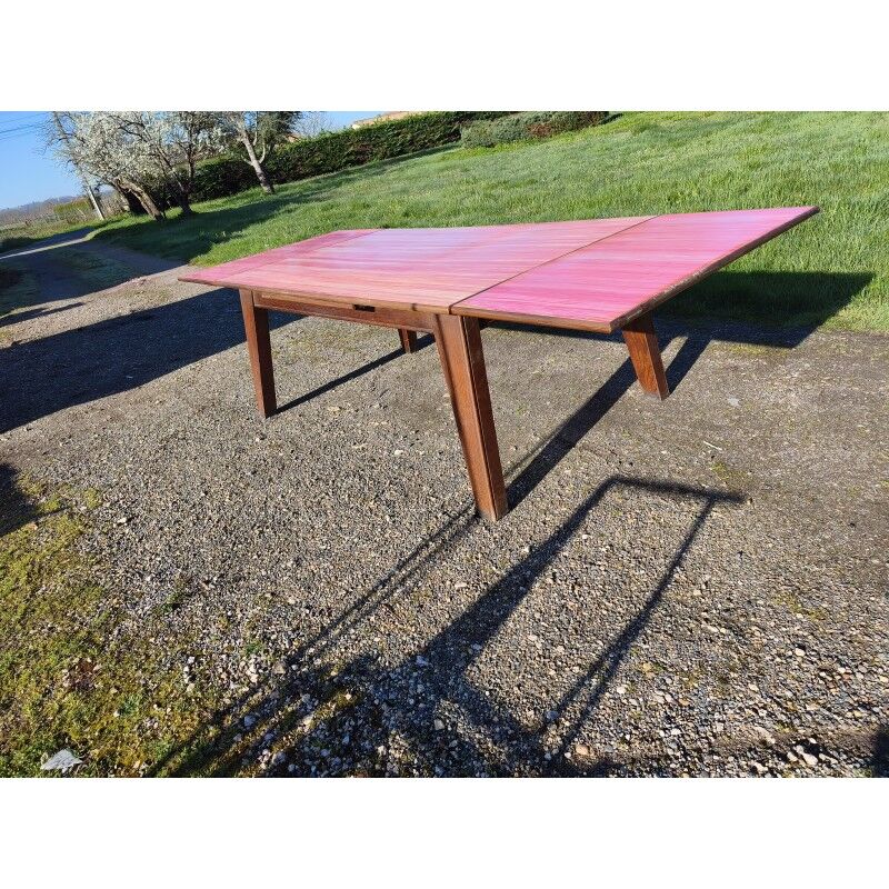 1960s oak dining table with integrated extensions.