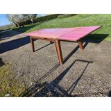 1960s oak dining table with integrated extensions.