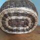 Very large oval laundry basket in two-tone braided wicker with handles