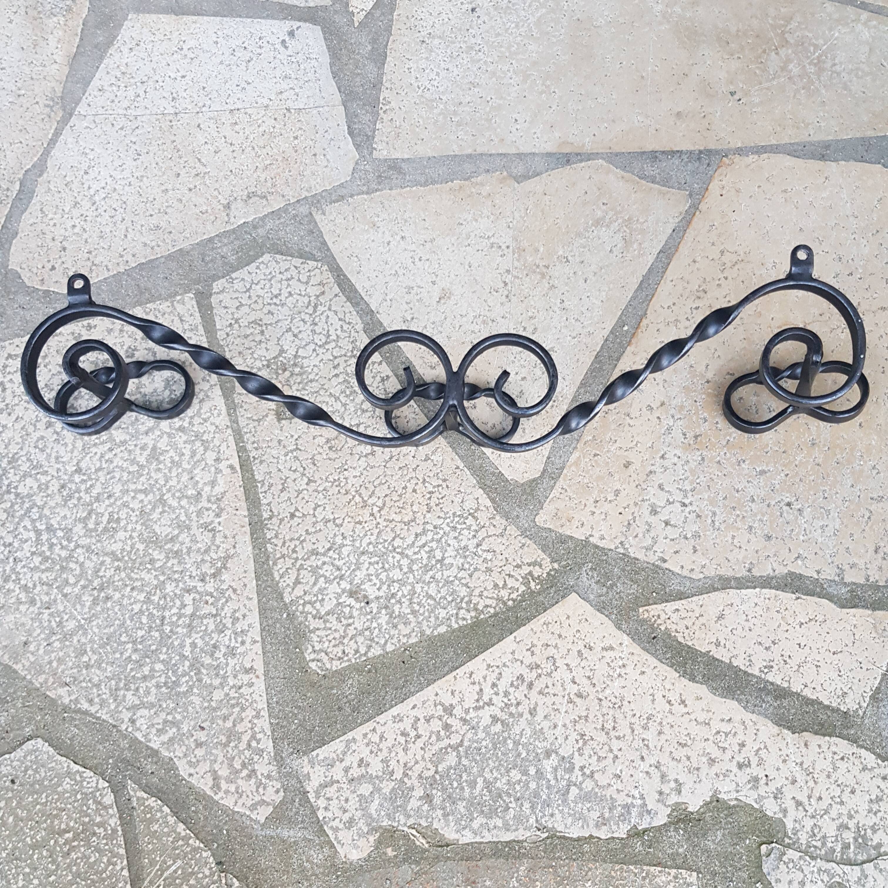 Wrought iron wall coat rack