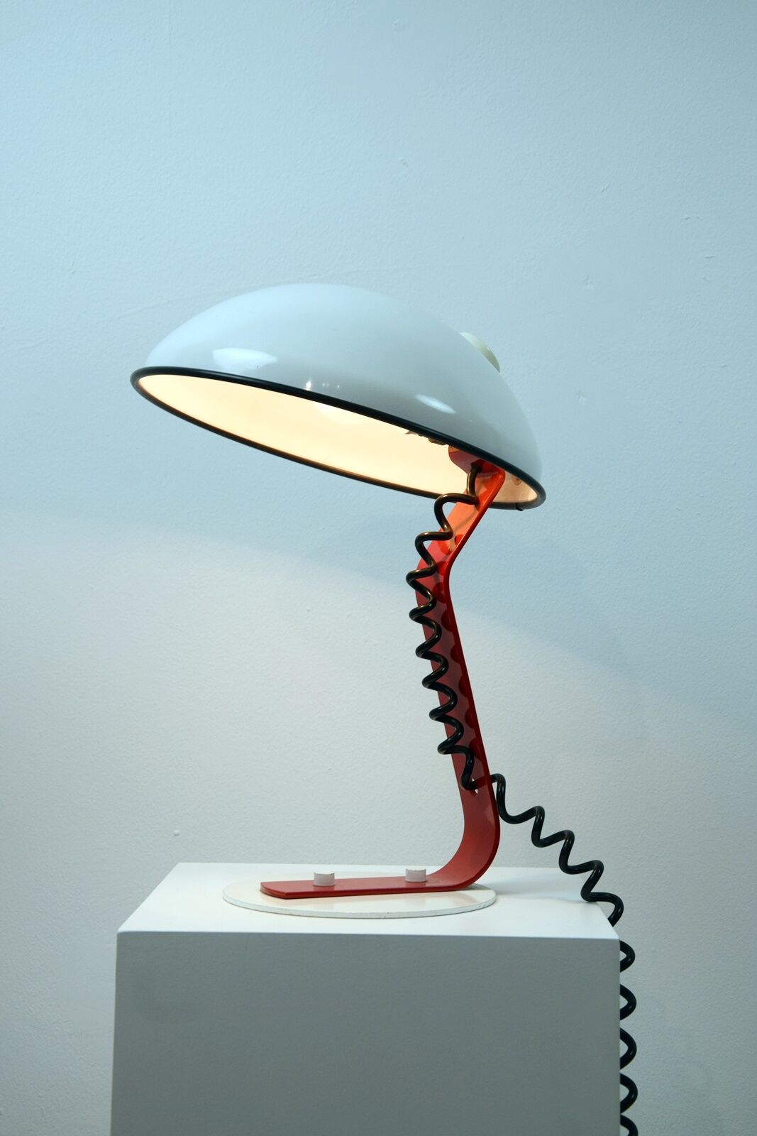 White and red steel desk lamp