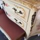 Curved Louis XV style commode in marble with painted floral decoration.
