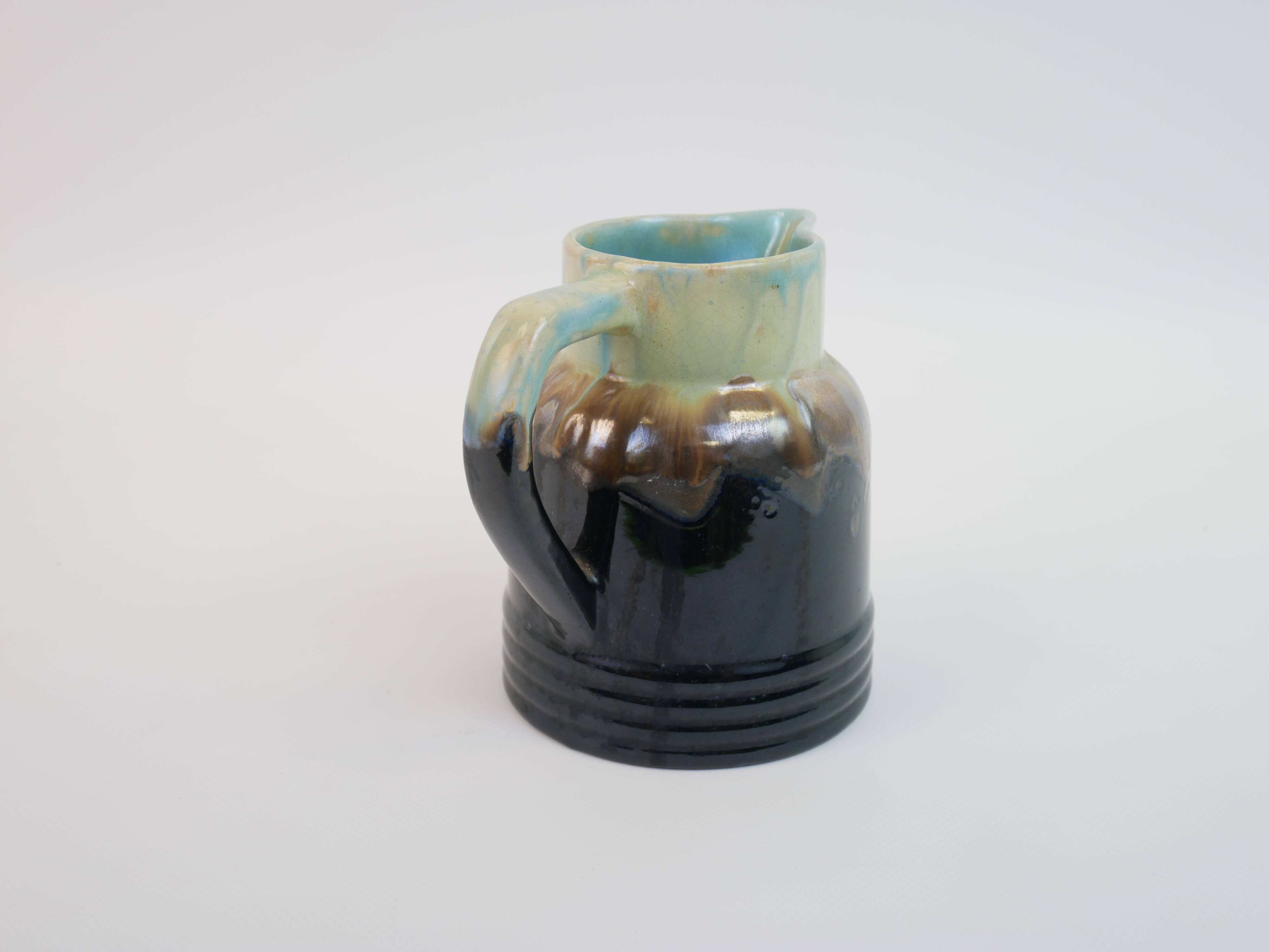Art Deco pitcher in black, brown and blue glazed ceramic
