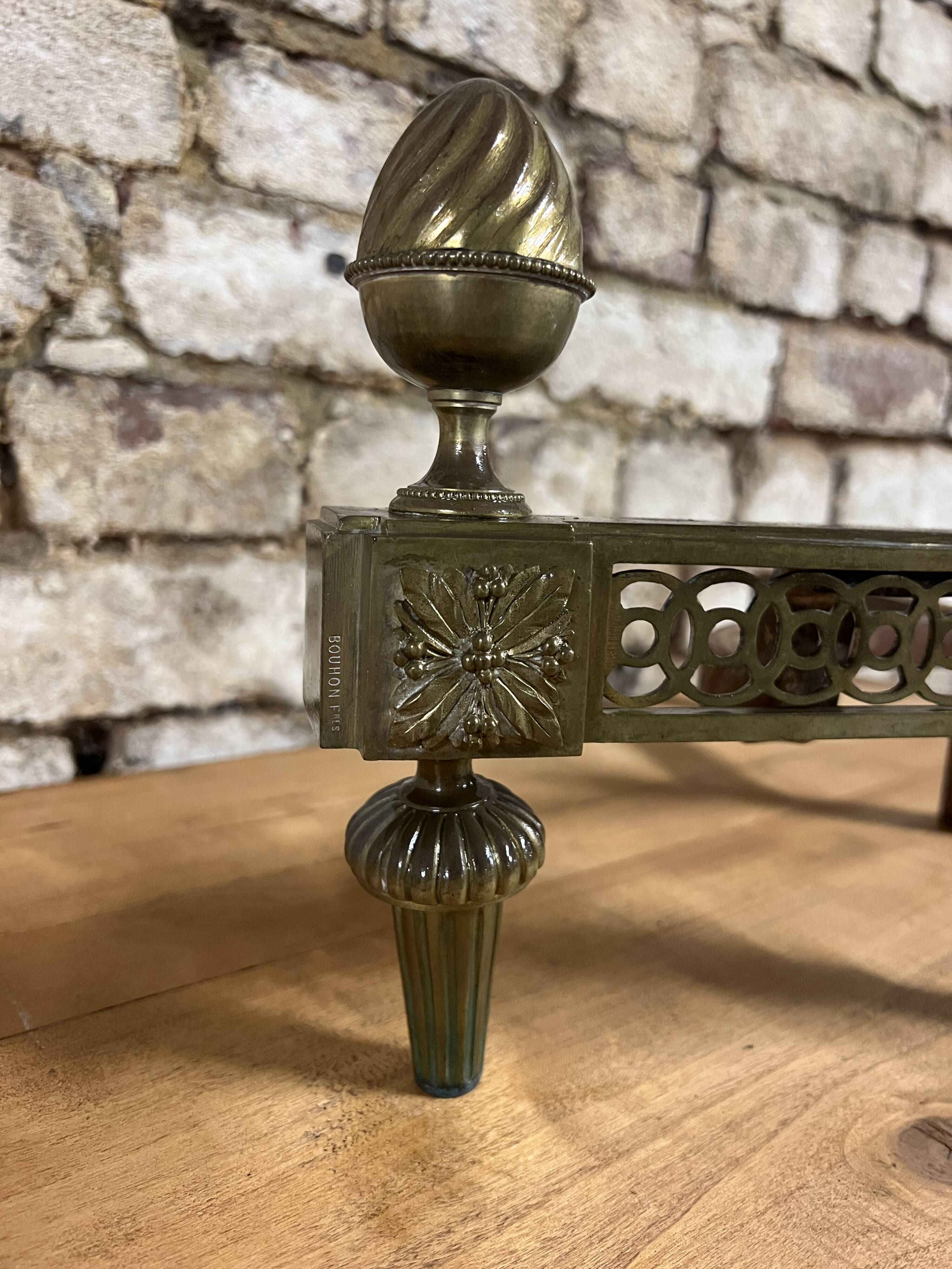 Pair of bronze andirons stamped bouhon frères in louis xvi style