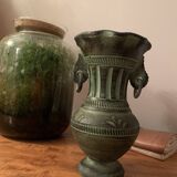 Ancient Greek style ceramic vase with curls