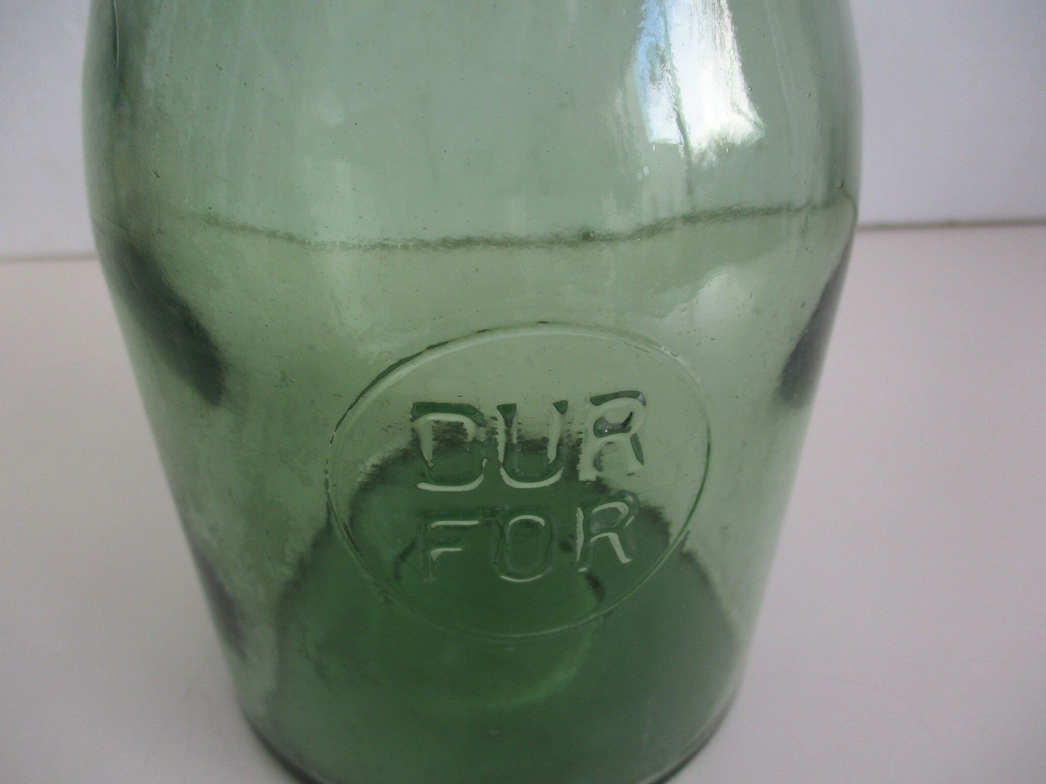 Old green glass jar, "DURFOR"