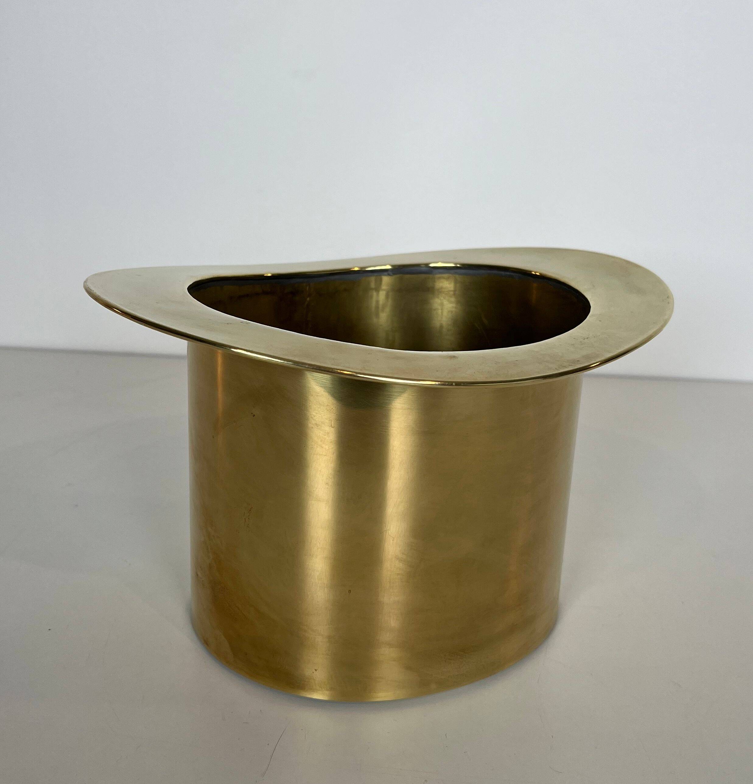 Champagne cooler shaped like a brass top hat.