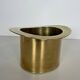 Champagne cooler shaped like a brass top hat.