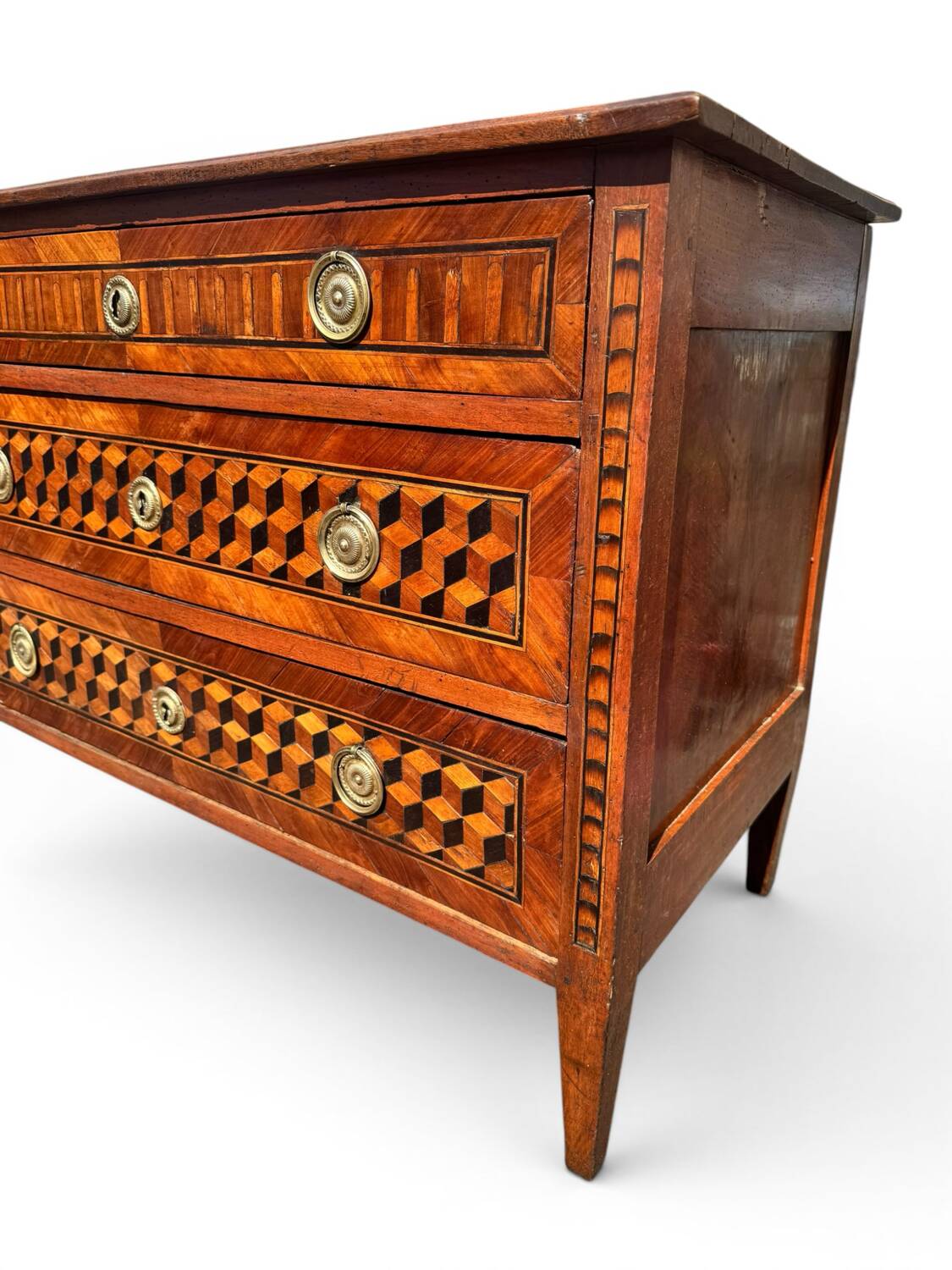 Louis XVI commode with marquetry featuring a design of precious wood cubes, 18th century.