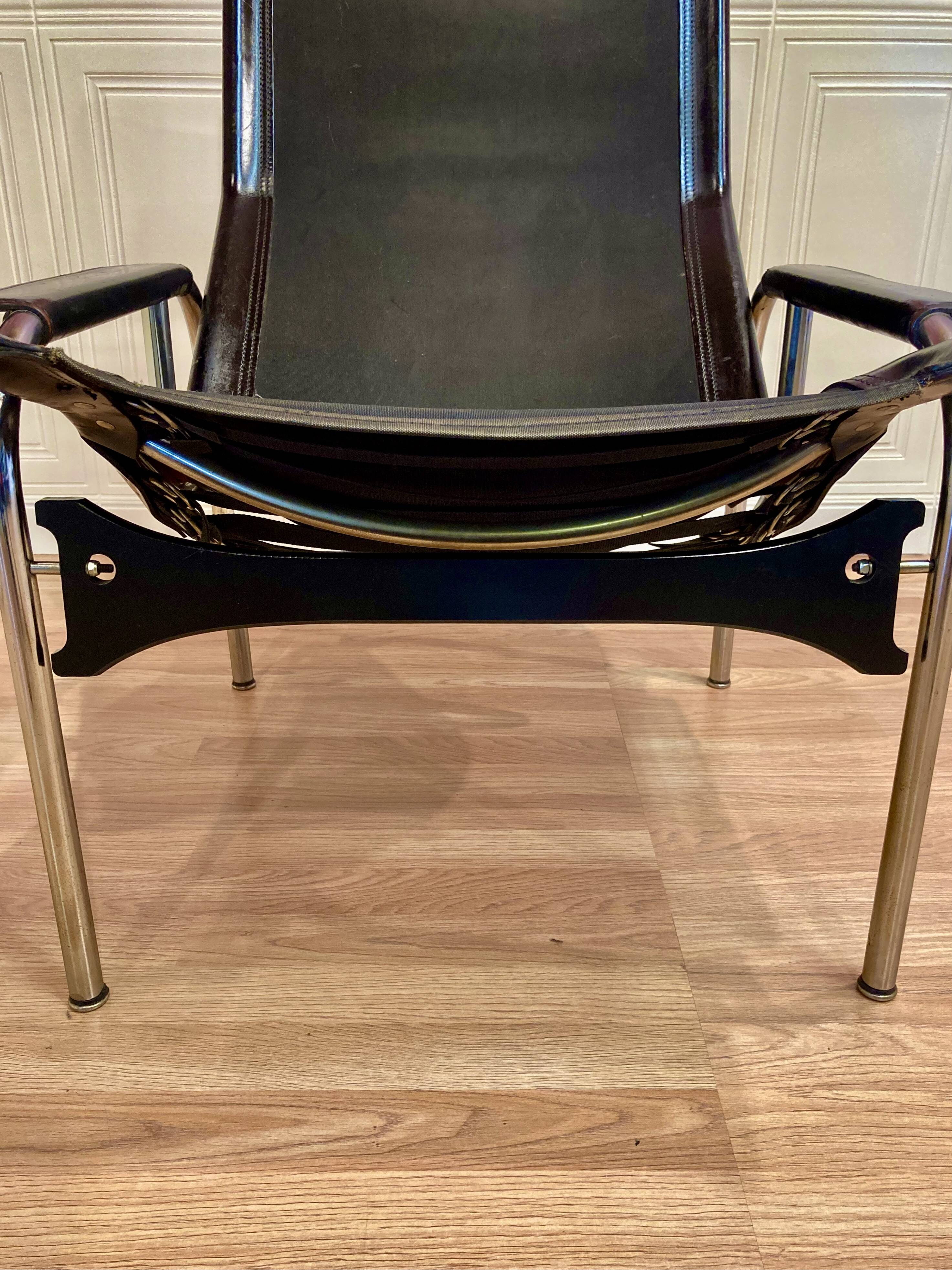Reclining armchair in black leather and chrome design "hans eichenberger" 1960.