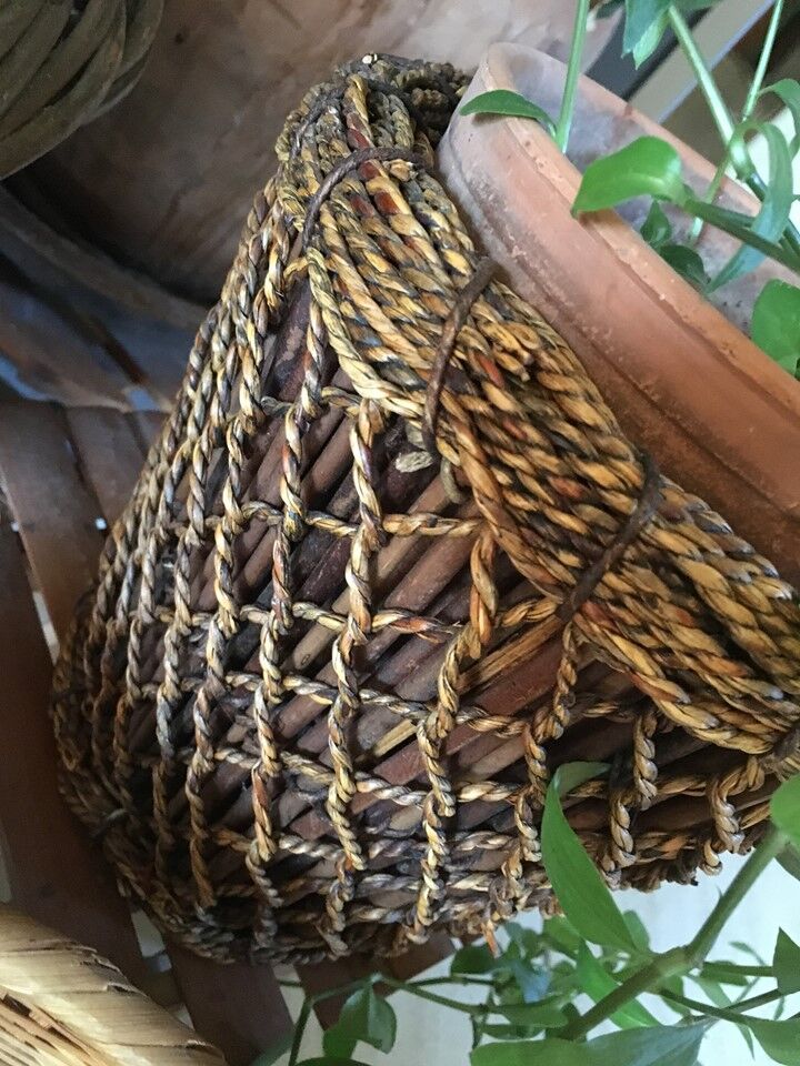 Two pot covers in Wicker, rope and wood.