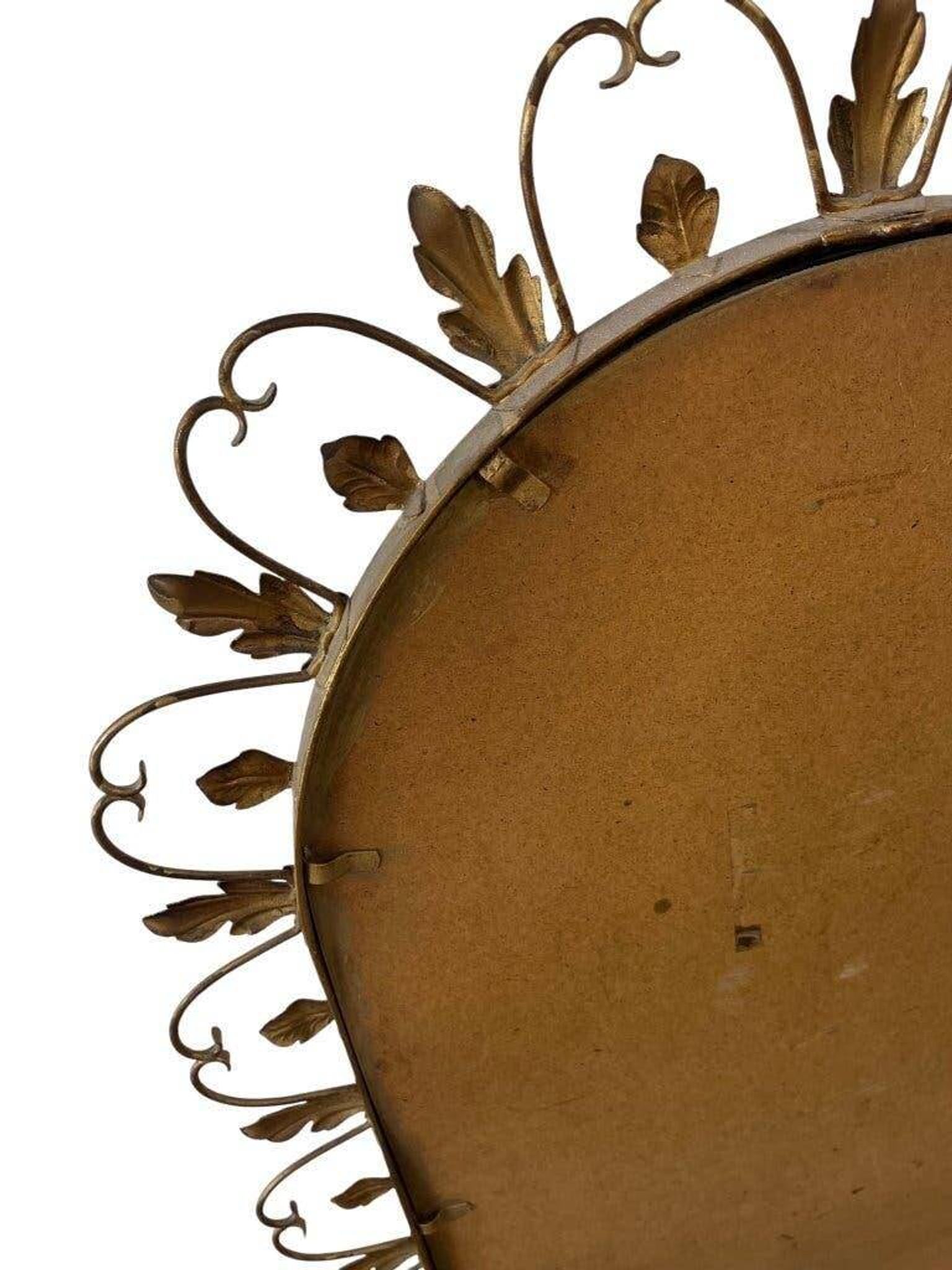 Vintage gold wall mirror with leaves