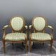 Pair of Louis XVI style armchairs in striped green fabric, 20th century.