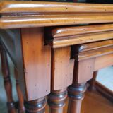 Nesting tables in solid cherry wood held together by slides