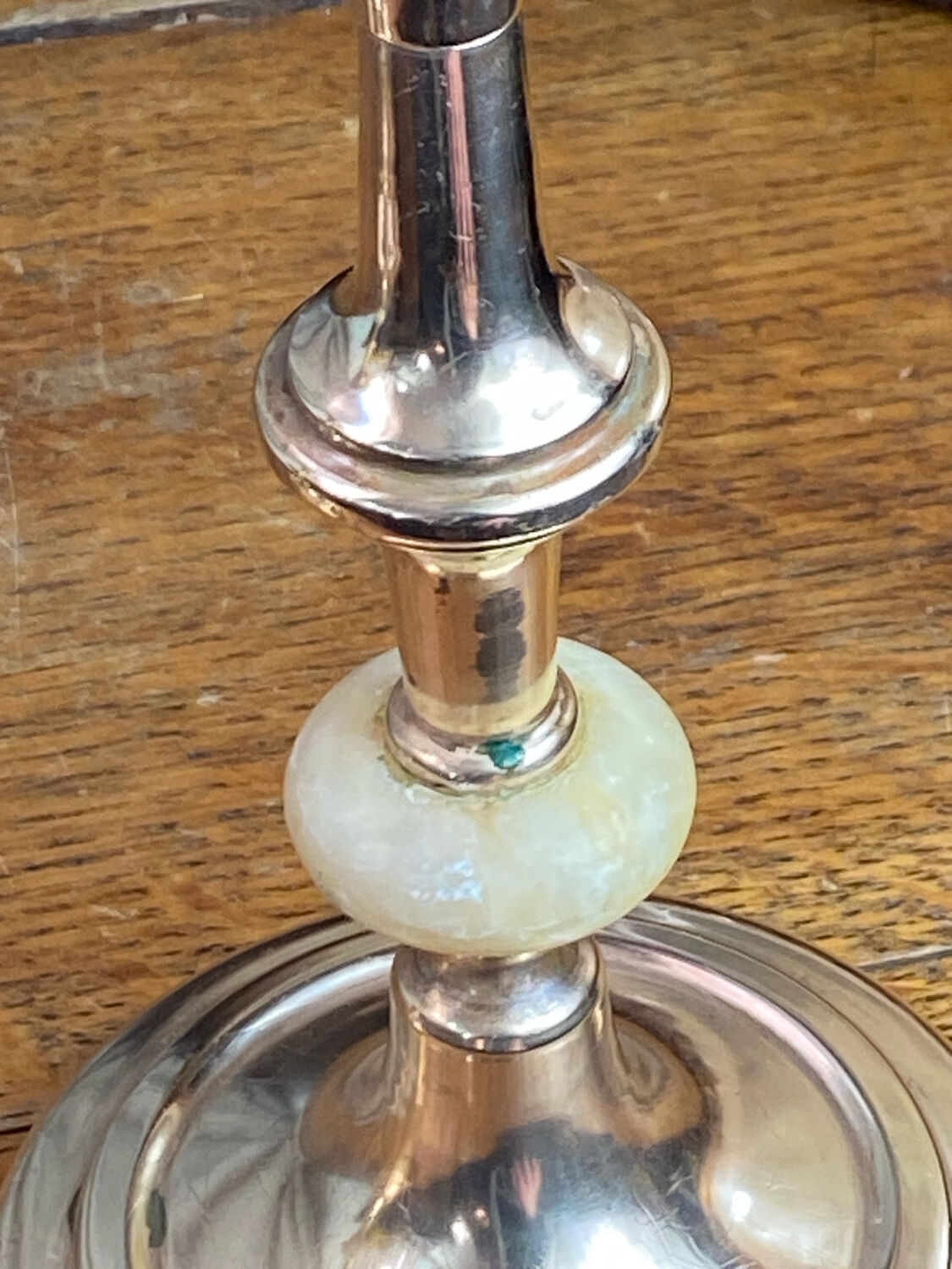Pair of brass and stone candlesticks