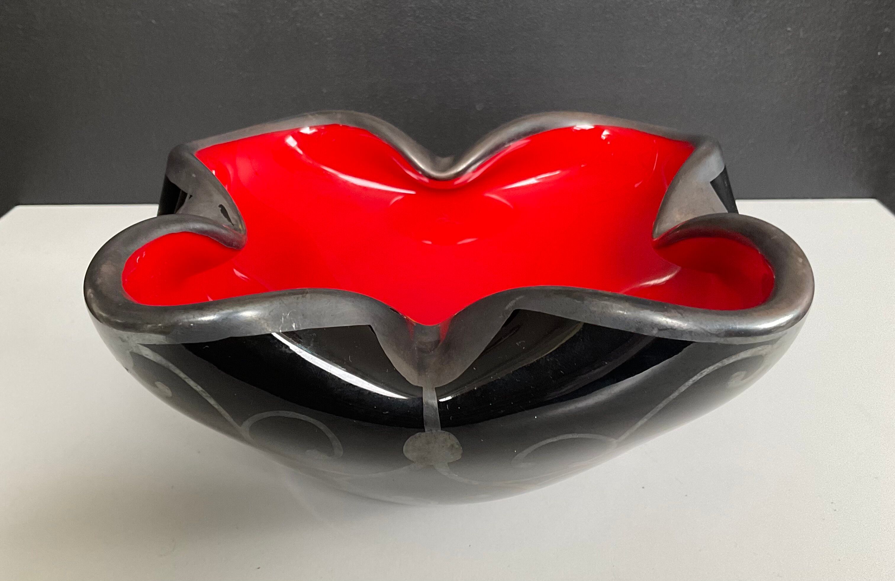 Vintage glass and silver catchall.
