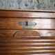 French antique wardrobe with curtain in oak, circa 1920–1930.