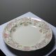 Antique Longchamp service shallow dish with polychrome daisies, ironstone, 19th century.