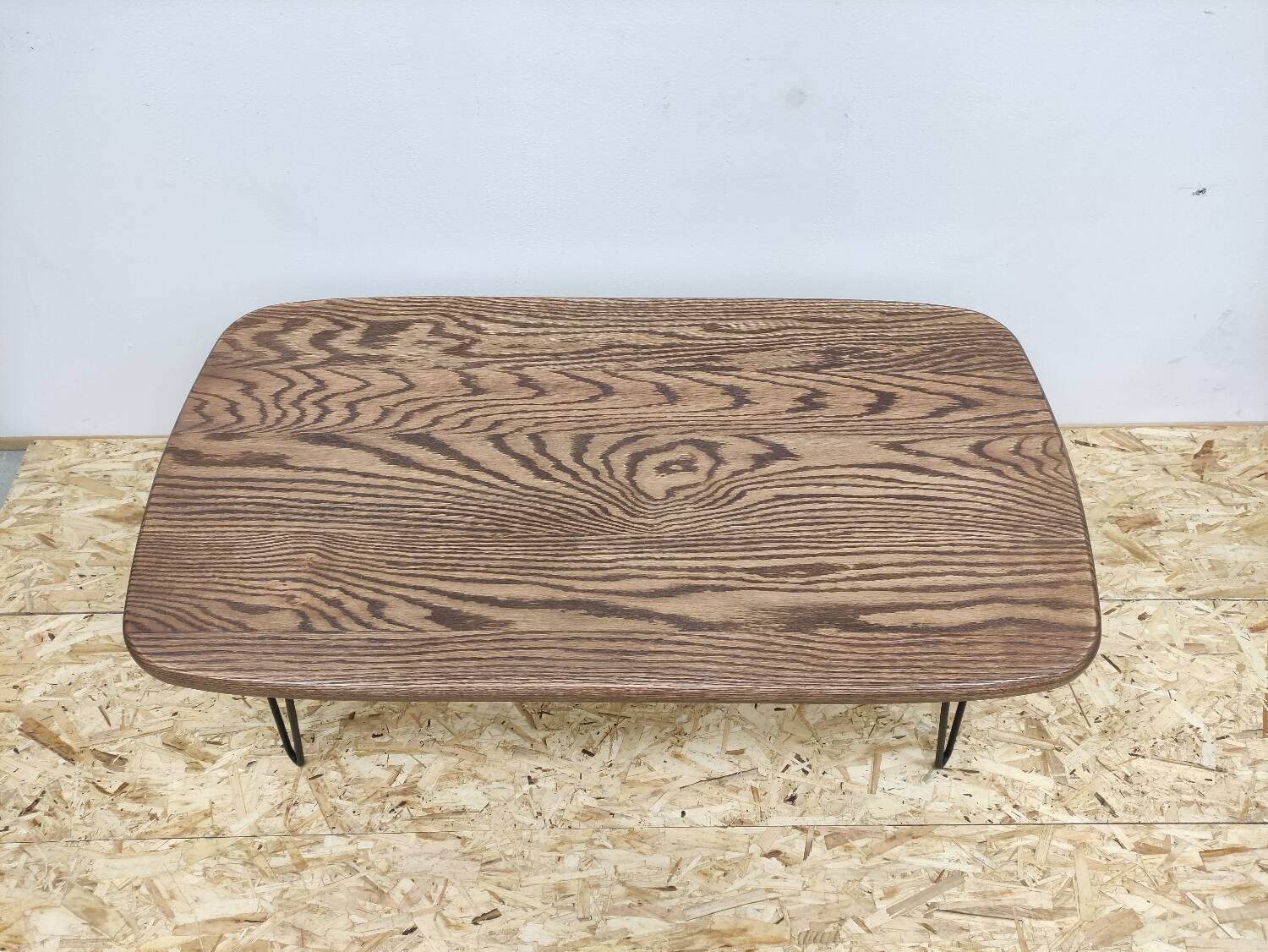 Solid oak oval coffee table with steel pin legs