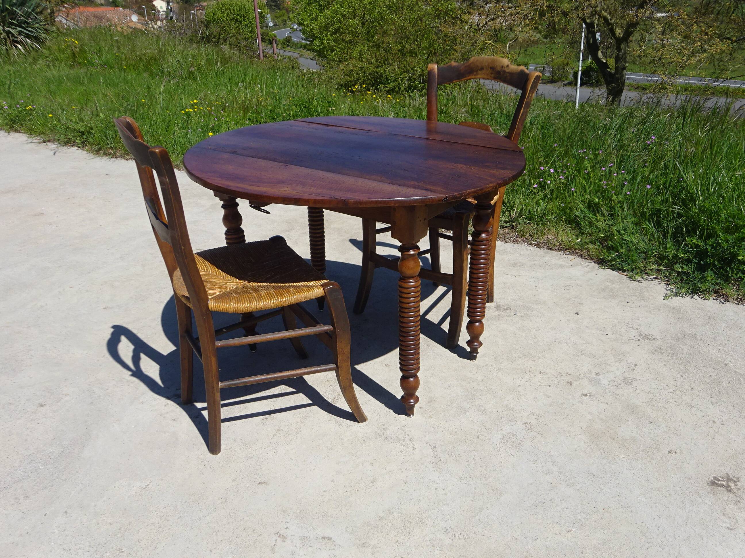 Antique walnut console table with honey spoon legs.