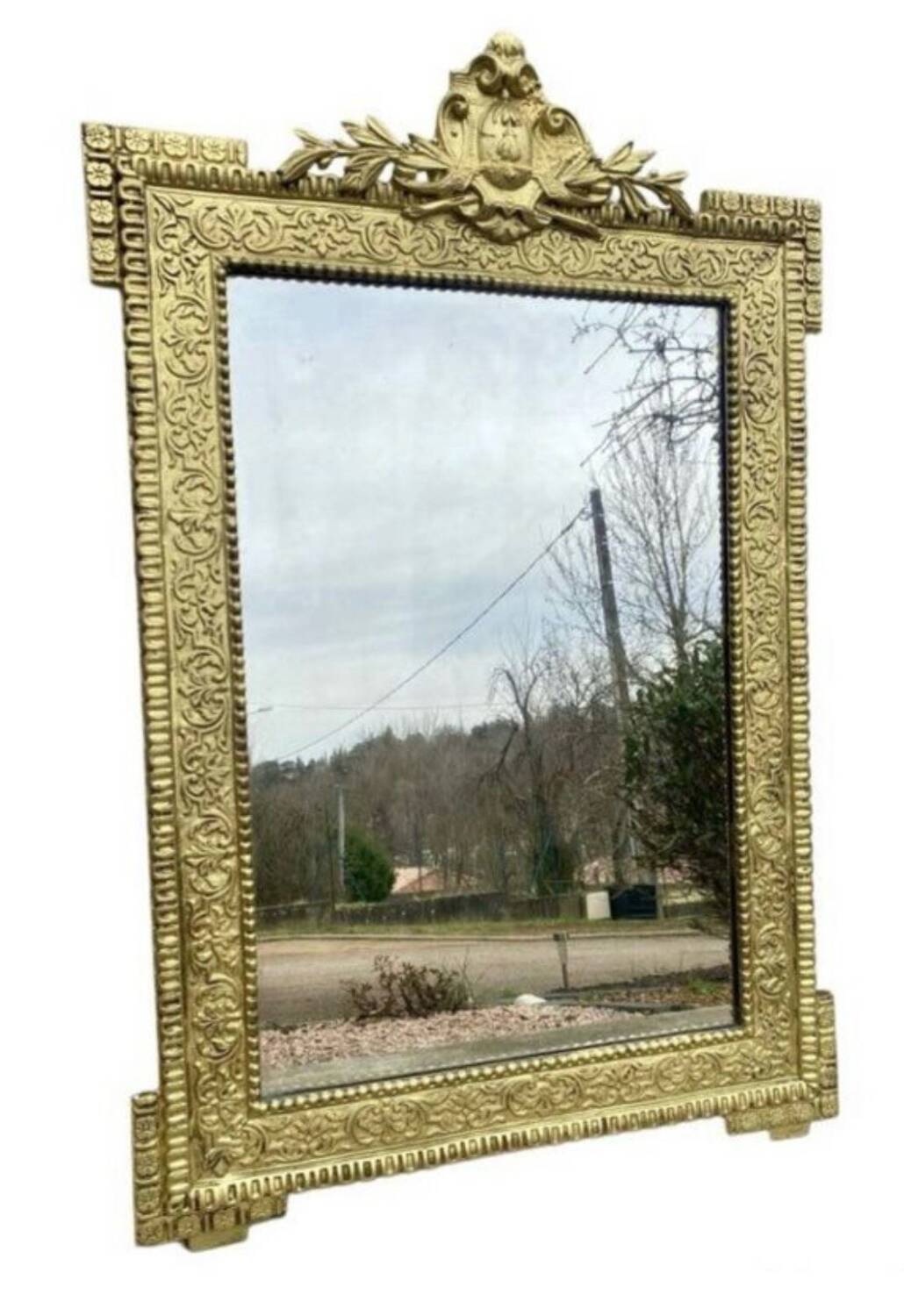19th-century antique mirror in carved gilded wood, Napoleon style.