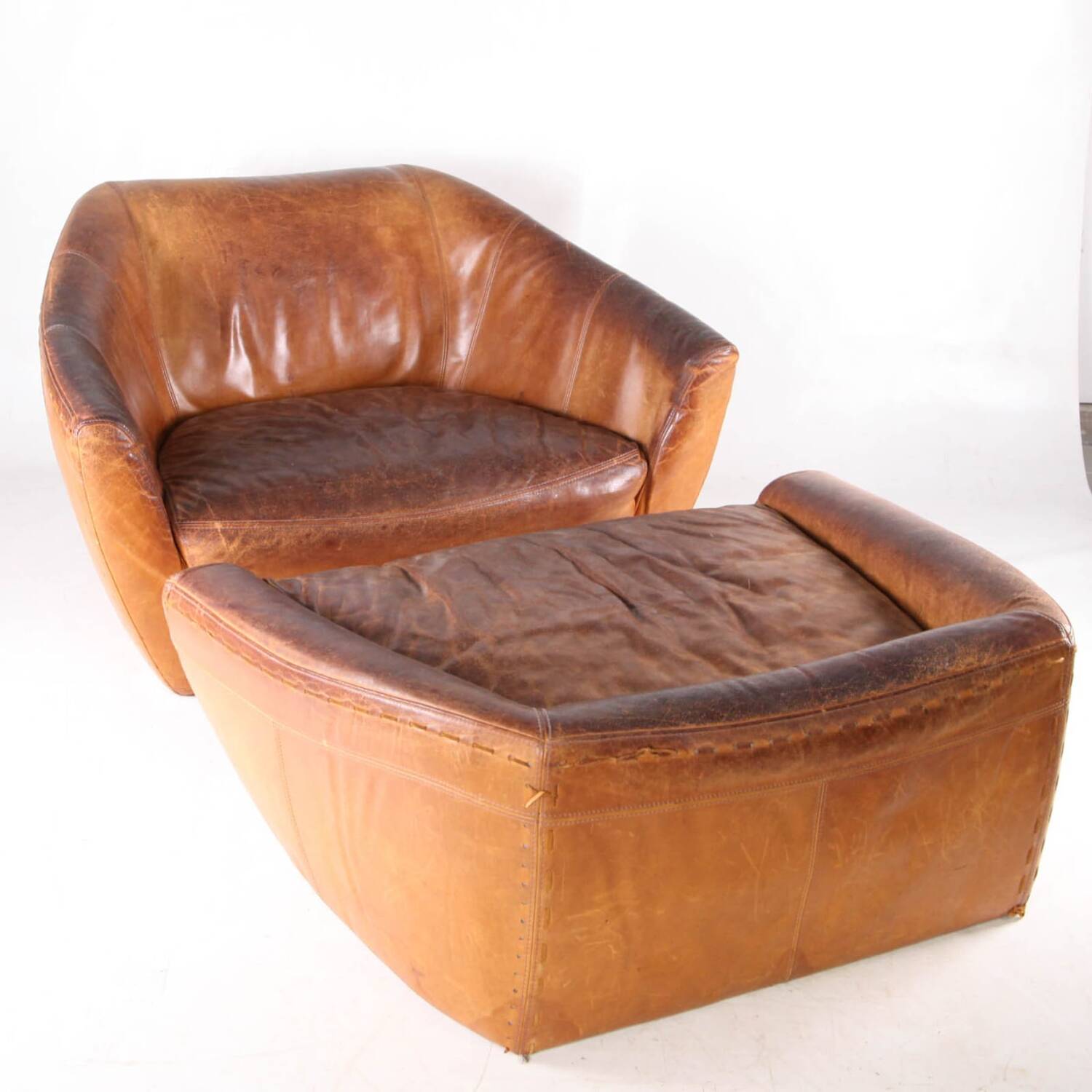 Grands fauteuil et ottoman en cuir