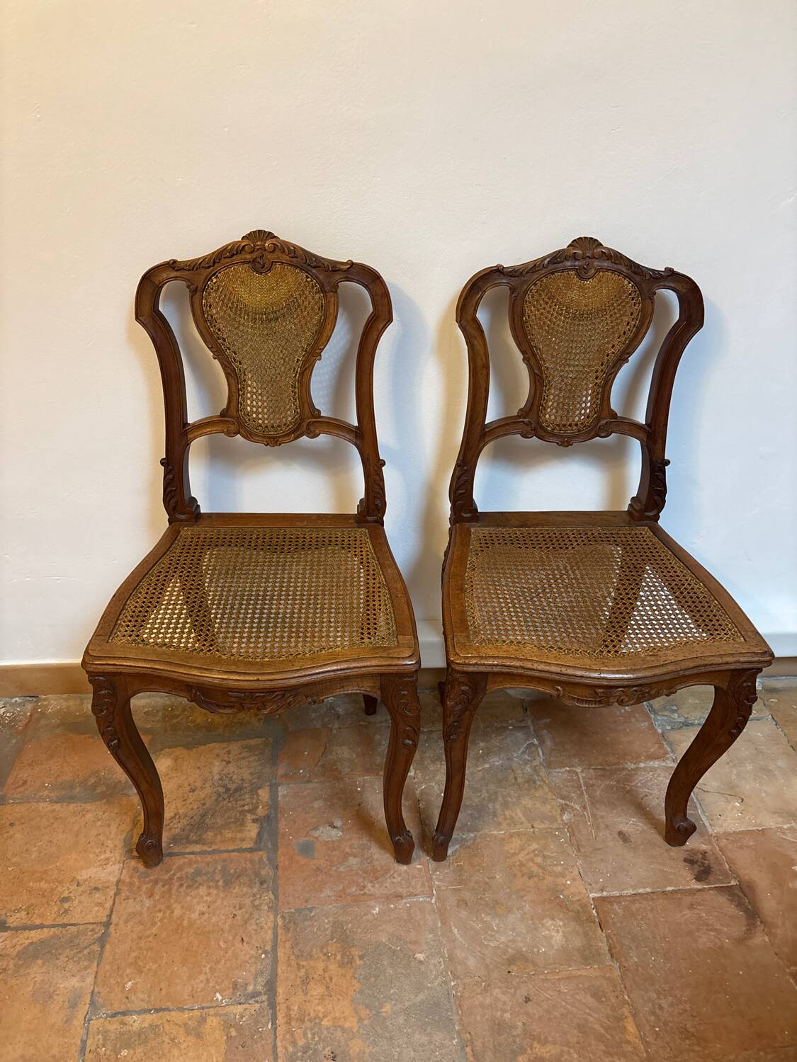 Pair of Louis XV style chairs in wood and caning.