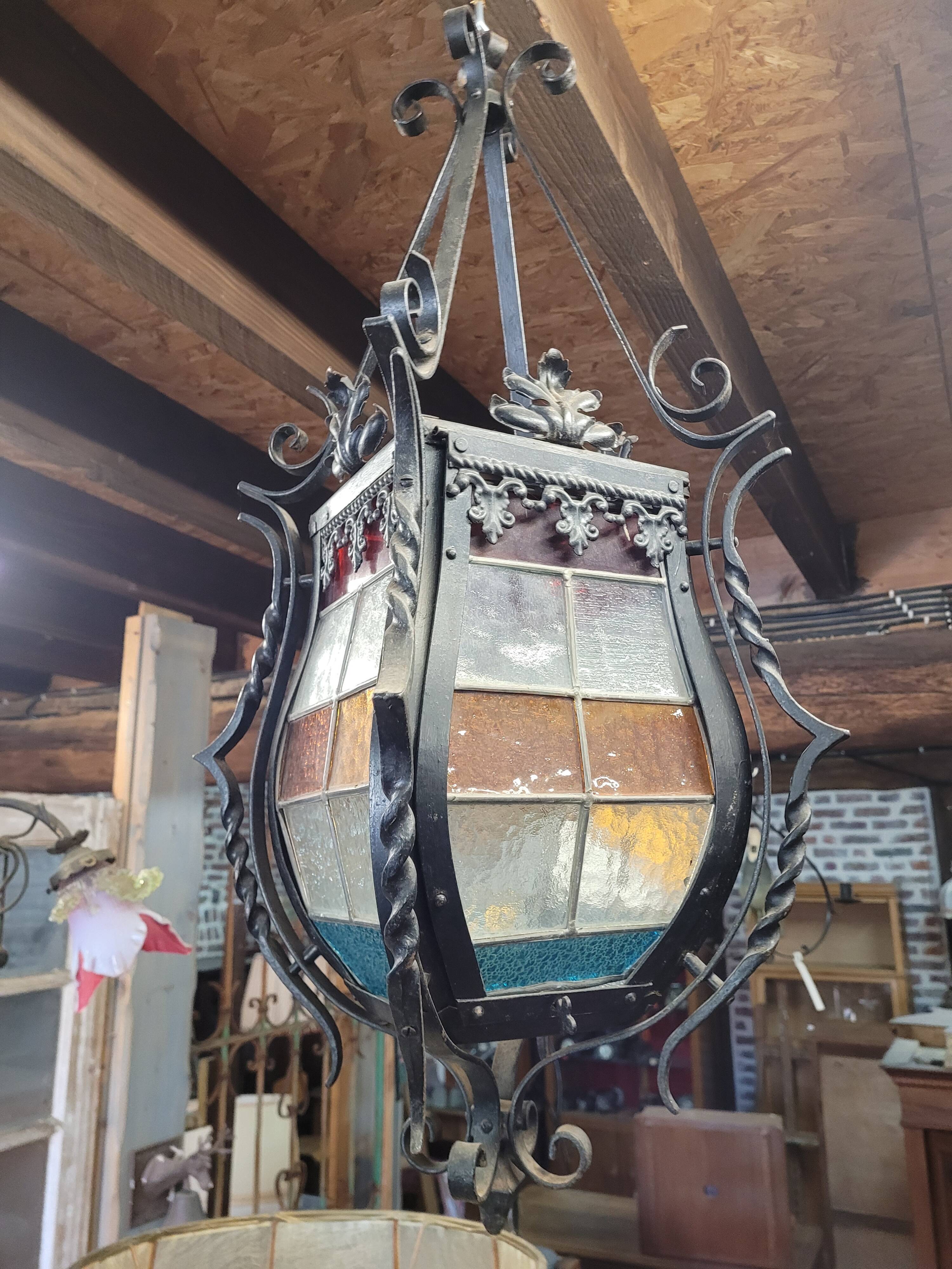Wrought iron lantern with stained glass windows
