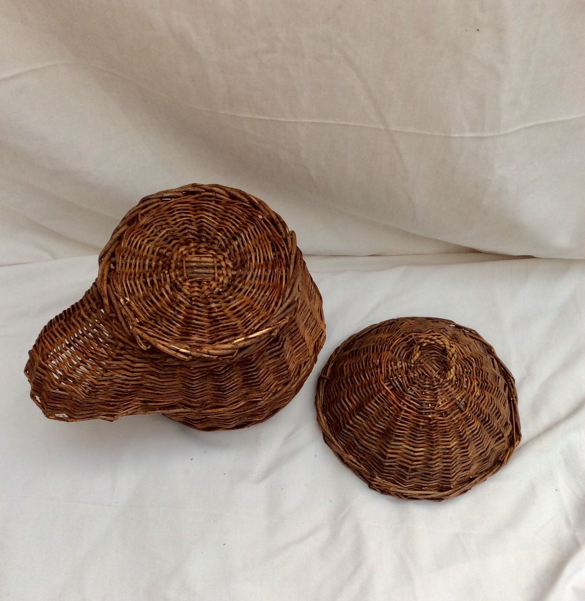 Wicker and rattan basket dispenser with lid