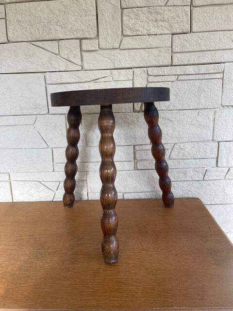 Low tripod stool with turned legs