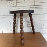 Low tripod stool with turned legs