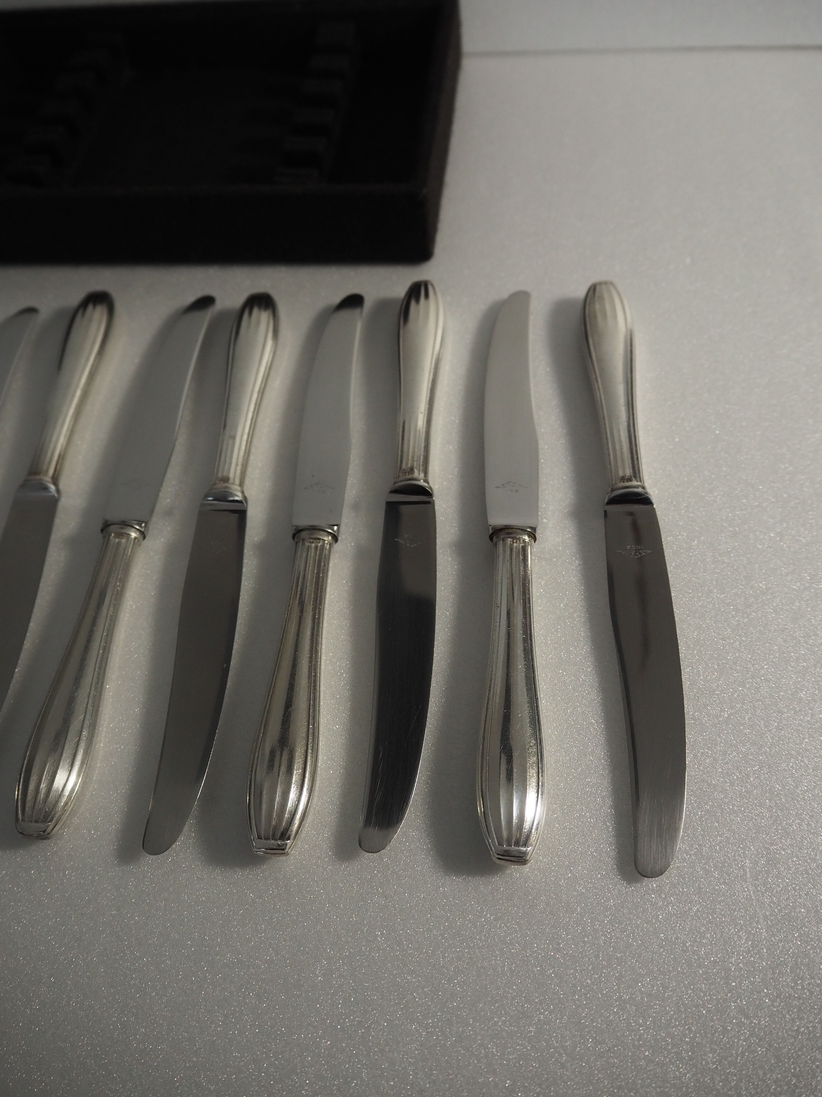 12 SFAM cheese knives in its dark chocolate case