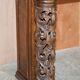 Antique fireplace from around 1880 in solid hand-carved elm with openwork columns.