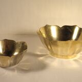 Two brass trundle cups