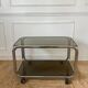 Rolling serving cart in chromed steel and smoked glass, 70s design