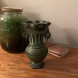 Ancient Greek style ceramic vase with curls
