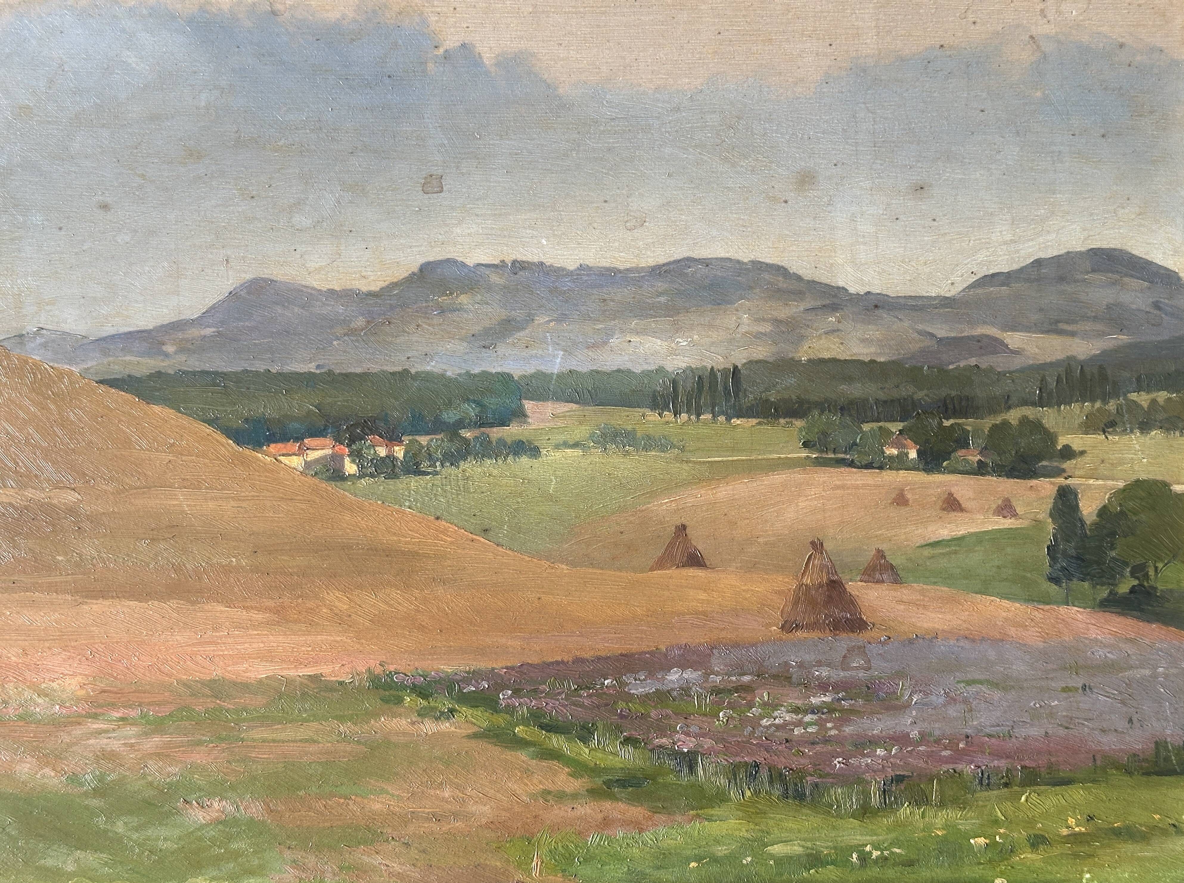 Old oil painting of a landscape on panel from 1920, haystacks.
