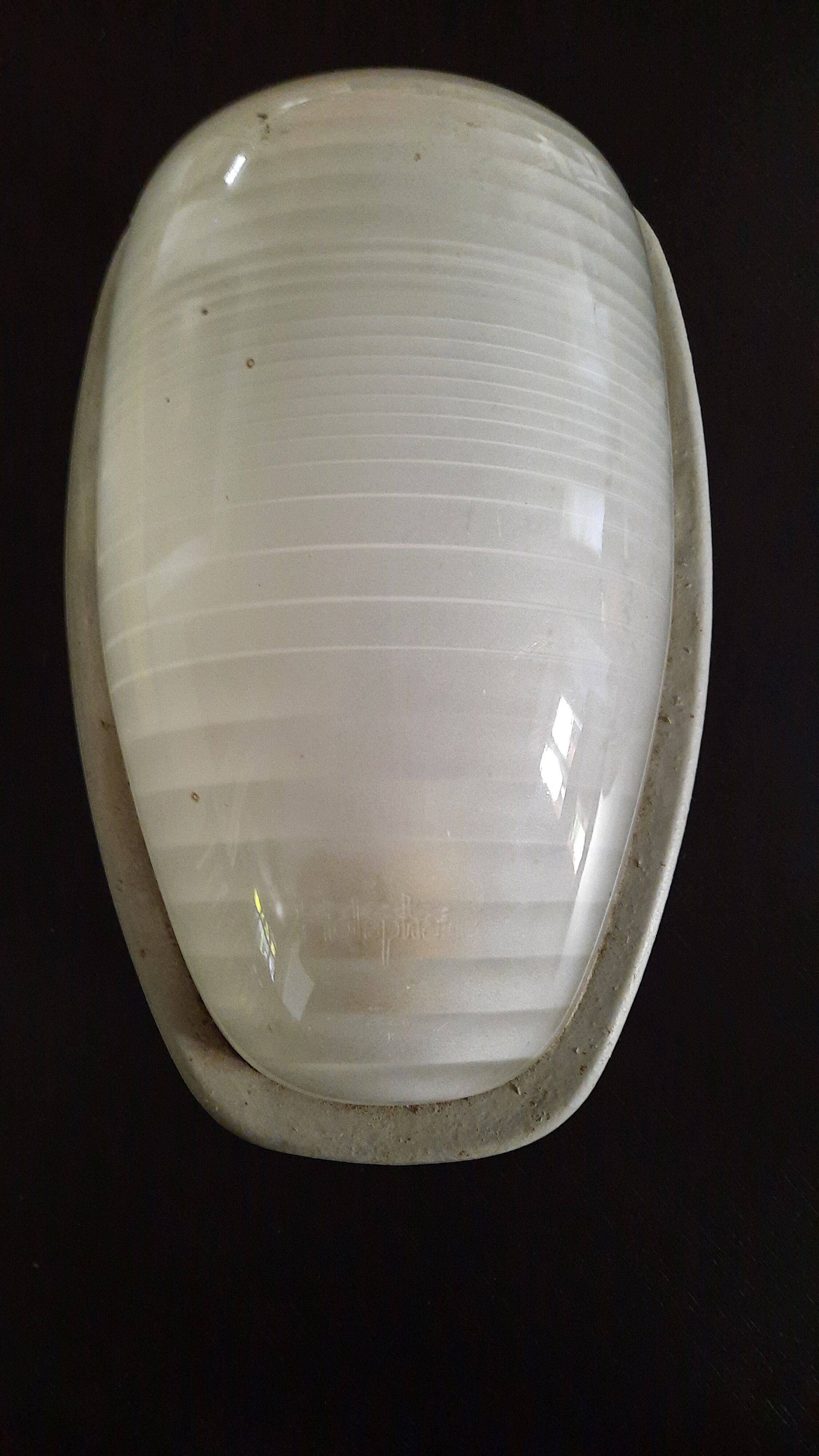 Holophanous cast iron wall lamp