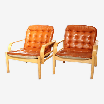 Upholstered leather armchairs 70s