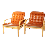 Upholstered leather armchairs 70s