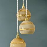 Suspension triple vintage glass globes in frosted yellow and gold.