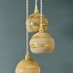 Suspension triple vintage glass globes in frosted yellow and gold.
