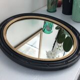 black and gold oval mirror