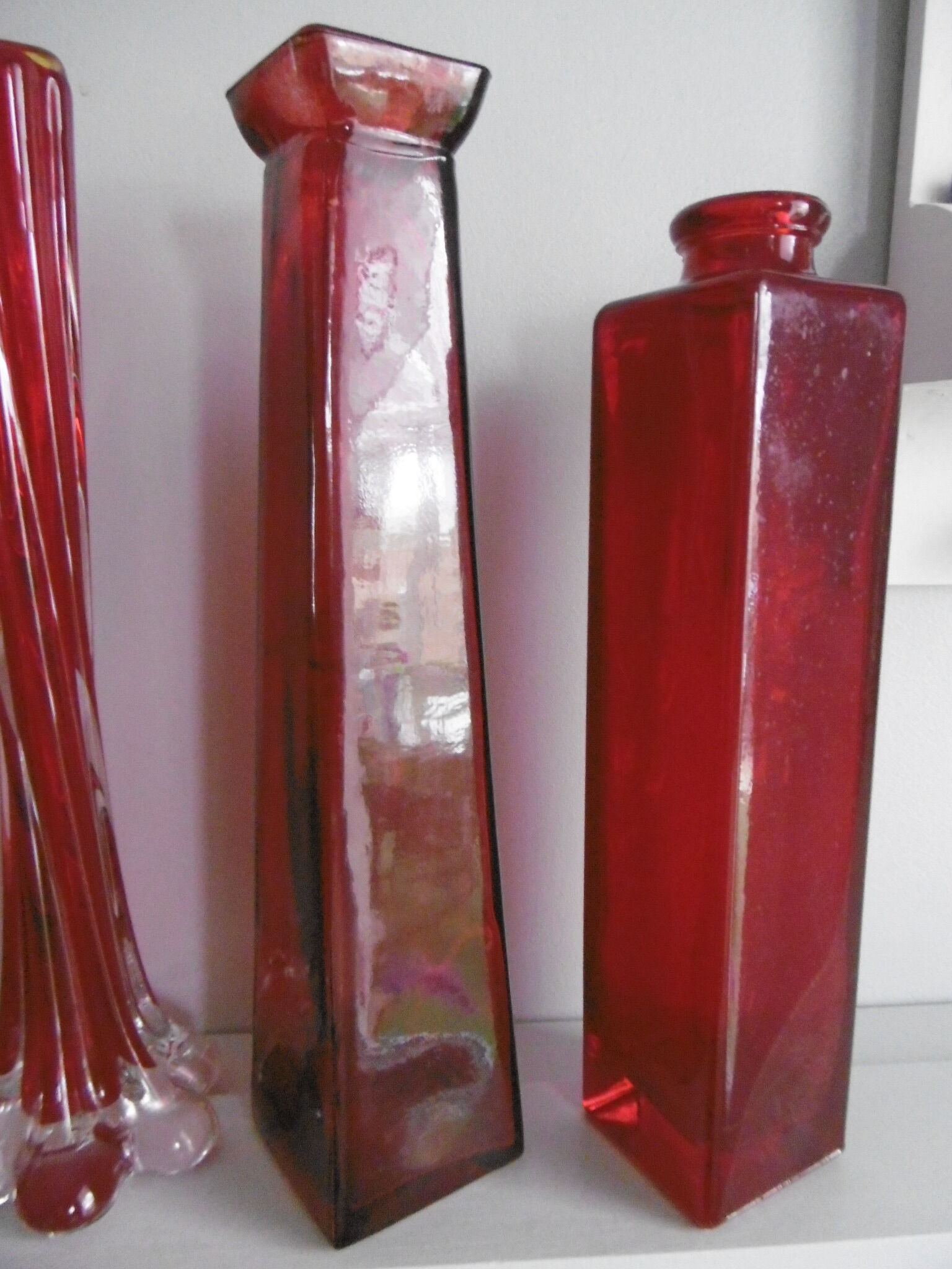 Set of three red bottles
